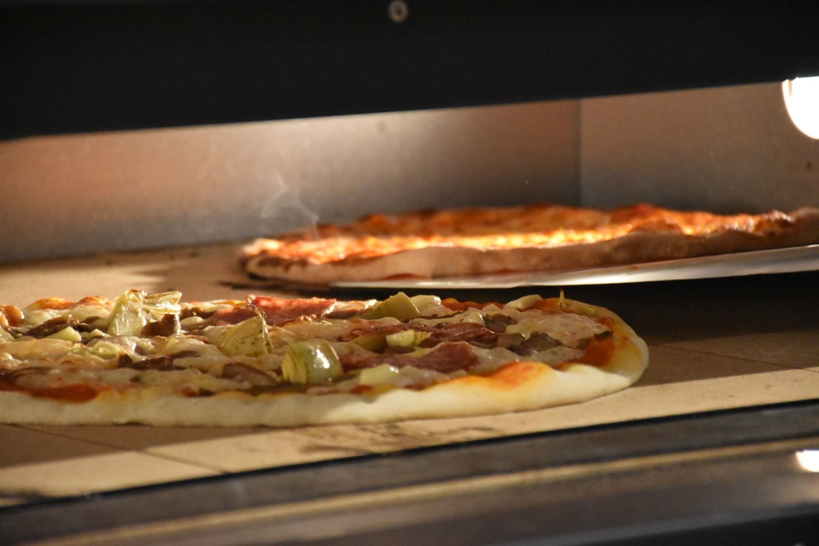 Vynikajúca pizza v reštaurácii Osteria zum Kirchenwirt
