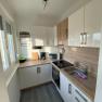 Bright kitchen with window and electrical appliances, © Kathi Brandstetter