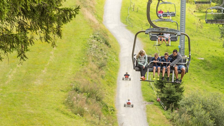 With the chair lift to the Schwaig, &copy; Erlebnisalm M&ouml;nichkirchen, Martin F&uuml;l&ouml;p