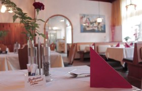 Restaurant Wirtshaus inside, set table with flower, &copy; Gasthubers Wirtshaus